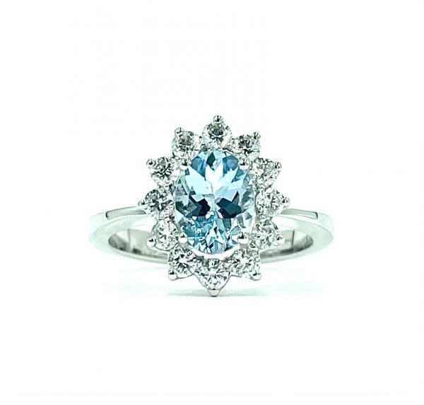 18ct white gold oval acquamarine and flower effect halo