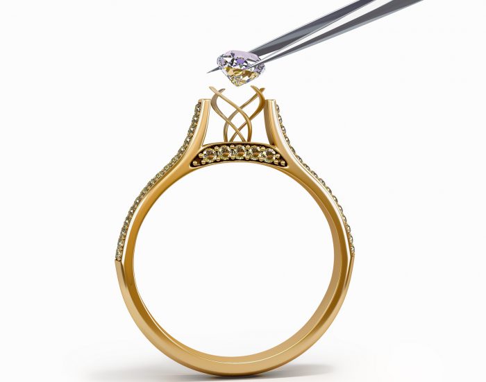 tweezers inserts diamond into ring