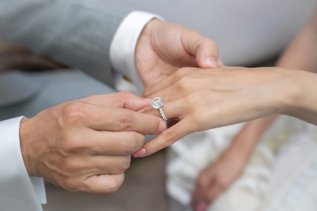 Wearing a ring at the wedding ceremony.