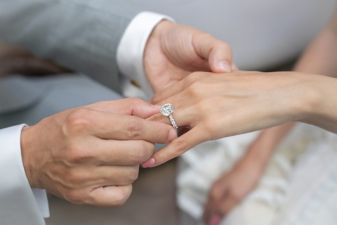 Wearing a ring at the wedding ceremony.