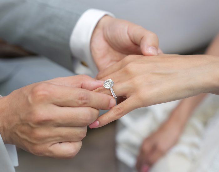 Wearing a ring at the wedding ceremony.